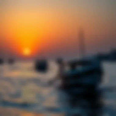 Dhow Boats at Dusk Traditional dhow boats sailing against a vibrant sunset
